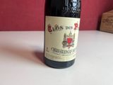 a bottle of wine that is sitting on a table