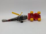 a toy airplane and a toy car on a white surface