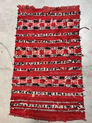 a close up of a piece of red and black fabric