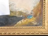 a picture of a painting of a blue eye in a gold frame