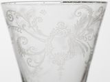 a glass with a pattern on it sitting on a table