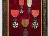 an old picture of a picture of a medal display in a frame