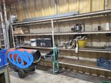 a room with a lot of shelves and tools in it