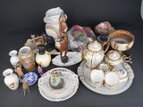 many different types of vases and dishes on the table