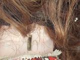 a close up of a woman ' s head with a scarf around her neck