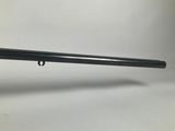 a close up of a rifle on a white background