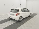 a picture of a white car parked in a garage
