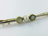 deux perles vertes et blanches sur une barrette plaquée or