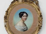 portrait of a woman in a white dress in a gold frame