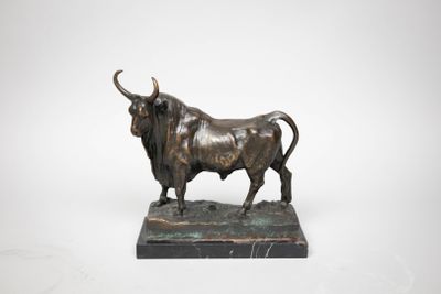 an image of a bronze bull statue on a marble base