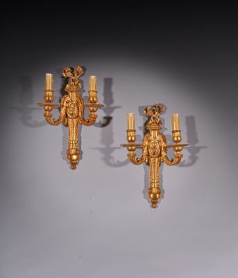 pair of antique wall sconces in the form of a man and woman