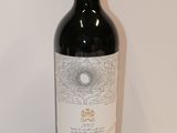 a bottle of wine that is sitting on a table