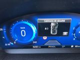 the dashboard of a car with a digital display on it