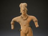 a statue of a woman holding a bird in her hand