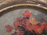 a picture of a painting of flowers in a gold frame
