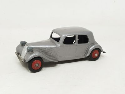 a toy car that is sitting on a white surface