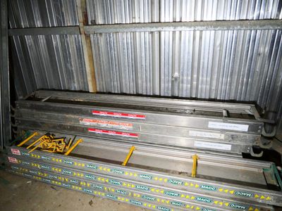 a stack of metal beams in a storage room