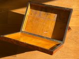 a small wooden box sitting on the floor on the floor