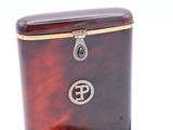 an image of a tortoise shell box with a diamond clasp