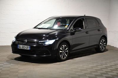 the volkswagen e - golf is parked in a garage with a checkered floor