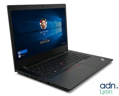 a black laptop with a picture of a man on the screen