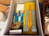 a box full of different items sitting on the floor