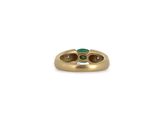 a close up of a gold ring with a green stone