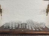 a lot of wine glasses sitting on a wooden table