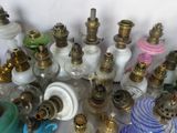 many different types of glass and brass items on the table
