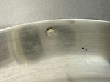 a close up of a metal pan with holes in it