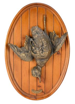 a bird that is hanging on the wall of a door