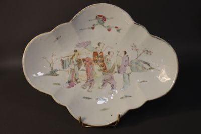 a white plate with a picture of people on it