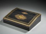 an image of a black and gold box on a table