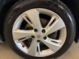 the tire of a car with a flat tire on the ground