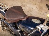 a close up of a motorcycle with a seat on it