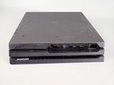 a black laptop computer sitting on top of a white table