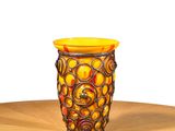 a vase that is sitting on a wooden table