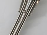a close up of a spoon and fork on a table