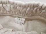 an image of a close up of a white shirt with a tag on it