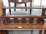 a wooden bench with a wooden chair on top of it