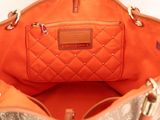 a purse that is inside of a purse on a table