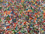 painting of multicolored paint splattered on a white wall