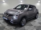 the nissan juke is parked on a checkered tile floor