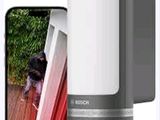 an image of a smart phone with a camera attached to it
