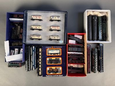 many different types of train cars in a box