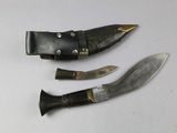 two knives that are sitting next to each other on a table