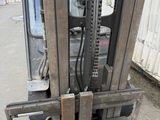 a forklift with two skis attached to the back of it
