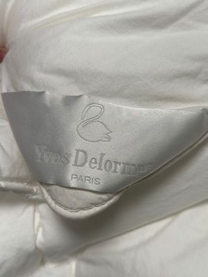 a close up of a pillow with a label on it