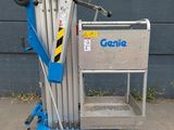 a small blue scissor sitting on top of a blue cart