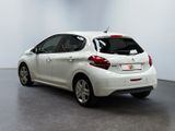 the rear of a white car is parked in a white room